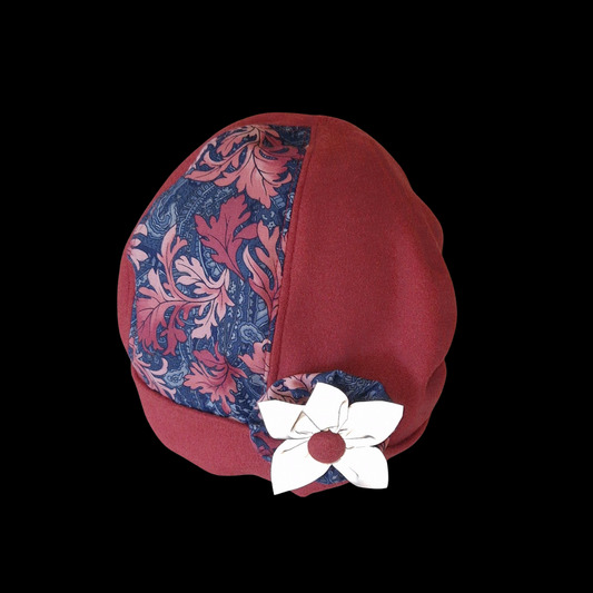 September - mössa med tillhörande reflexbrosch