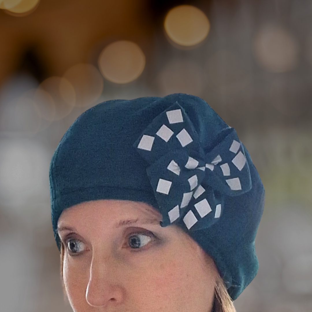 Alba - mössa med tillhörande reflexbrosch